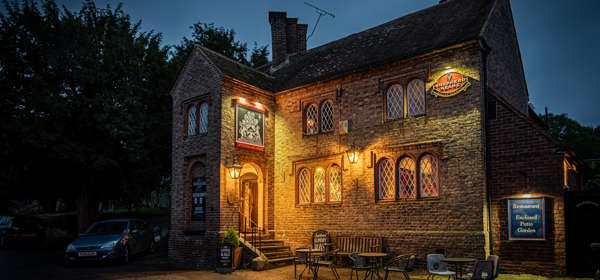 Exterior of Fitzwalter Arms lit up at night