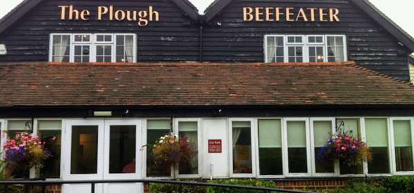 Exterior of The Plough Beefeater with sloped access to double doors