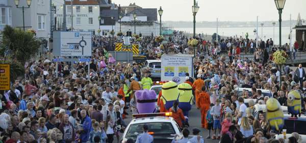 Crowds lining the streets at Deal seafront watching the carnival parade