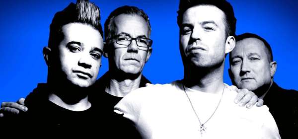 Photo of the 4 male members of the band The Devout