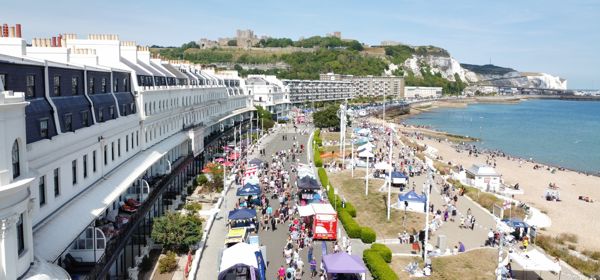 An aerial view of Dover Regatta, Dover seafront and the castle and cliffs in the background.