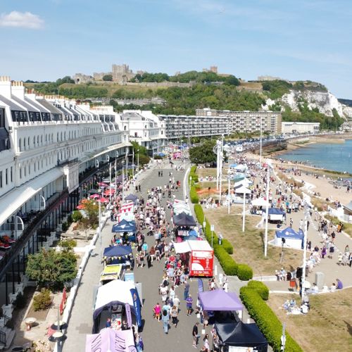 An aerial view of Dover Regatta, Dover seafront and the castle and cliffs in the background.