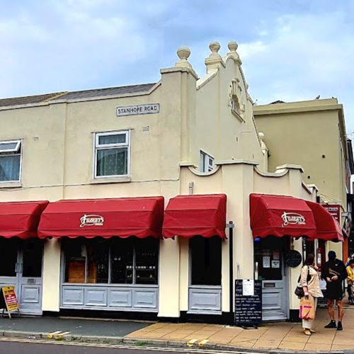 Exterior view of Filberts Foods with red awnings
