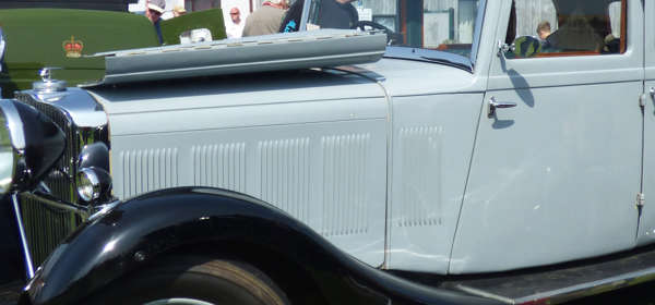 Classic grey car with bonnet folded open