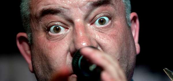 Photo of band vocalist Boysey Battrum singing