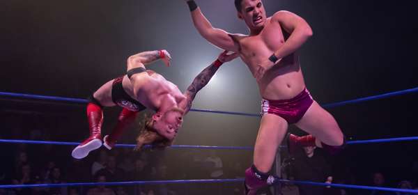 Photo of 2 wrestlers fighting in the ring
