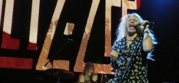 Photo of the lead singer of the band Letz Zep performing on stage live