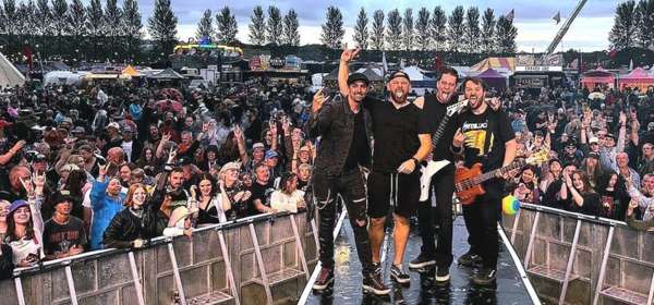 Photo of 4 male members of the band Metallica Reloaded