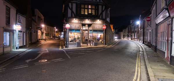 Night time exterior of The Old Pharmacy Bar