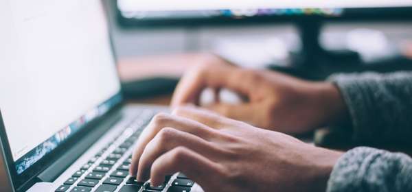 hands tapping on keyboard