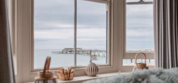 View from a window of the sea and Deal Pier.