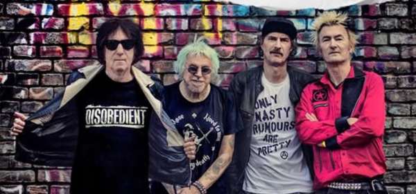 Four male members of the punk band UK Subs