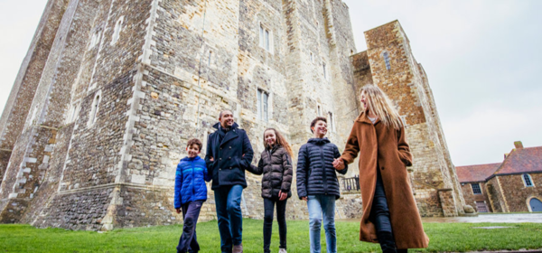 A family group in front of the Great Tower at Dover Castle